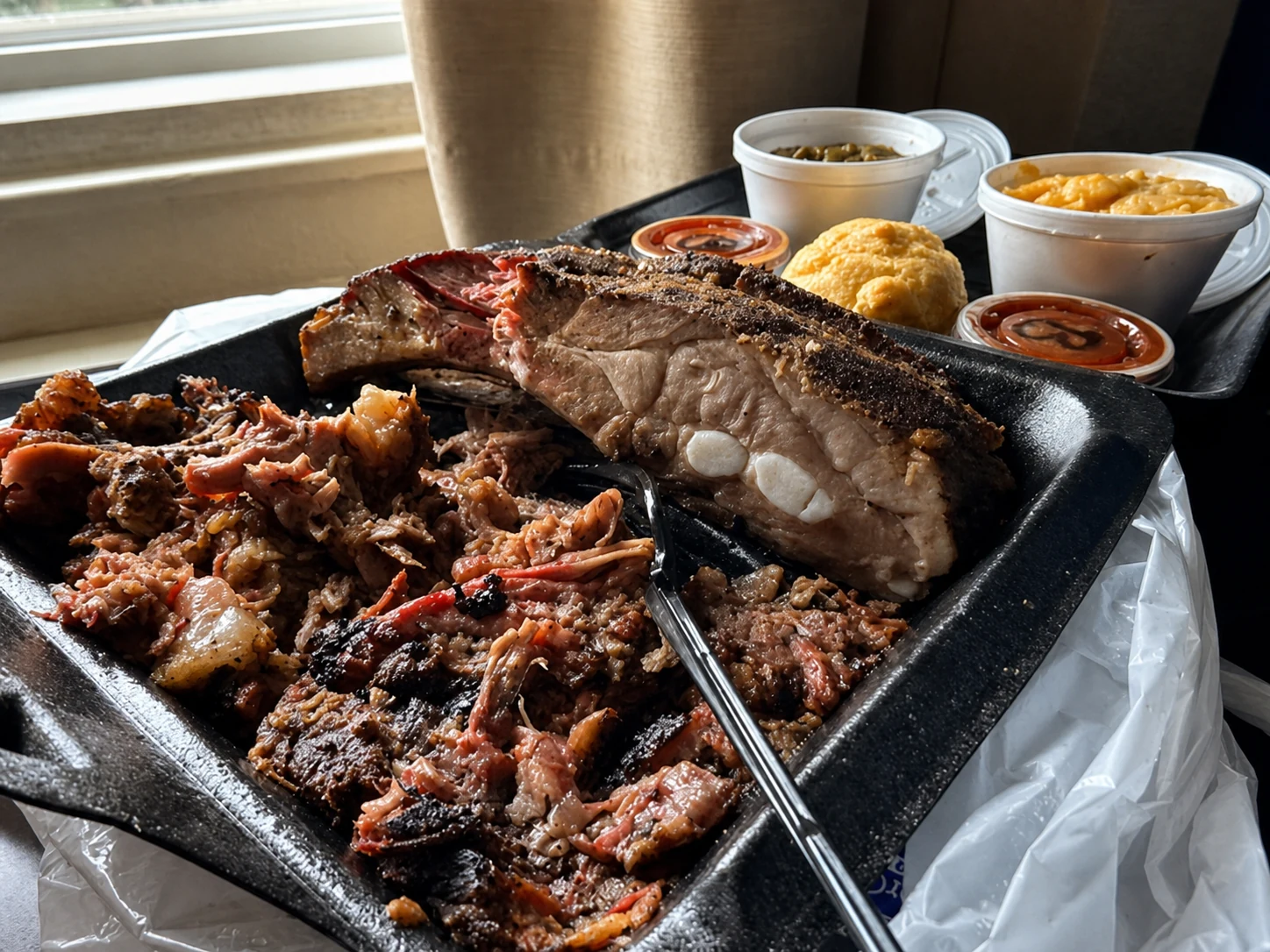 Two meat plate with ribs, chopped brisket, smoked mac and smoked green beans